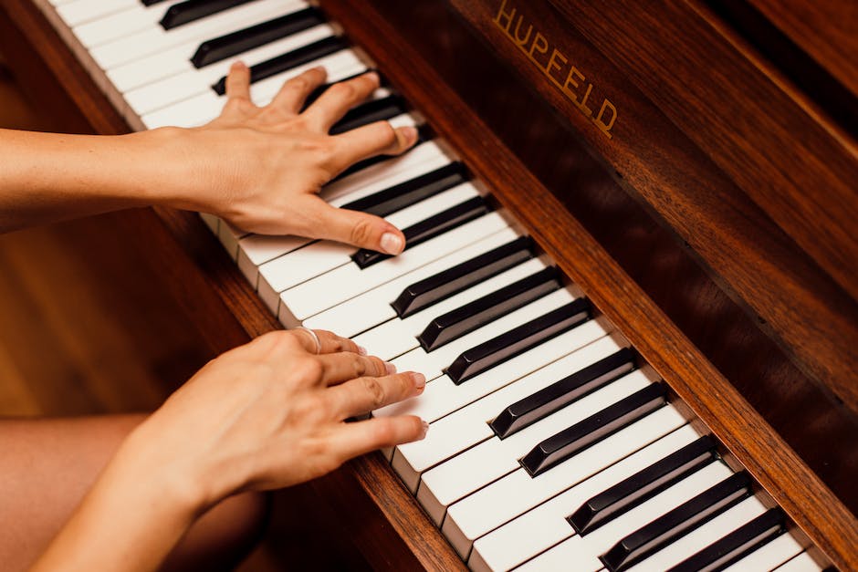 An image of a person playing a musical instrument, representing the concept of music theory.